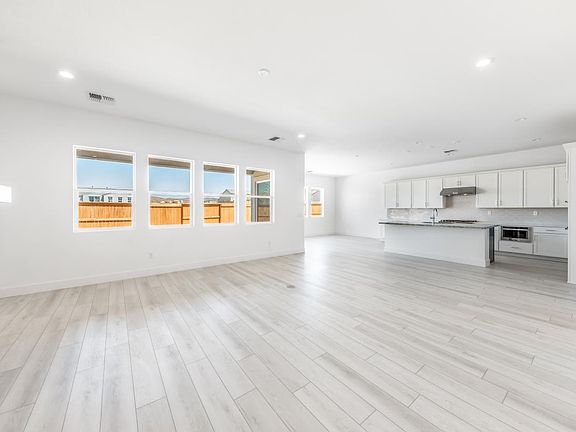 Open-concept floor plan ideal entertaining with a cozy fireplace