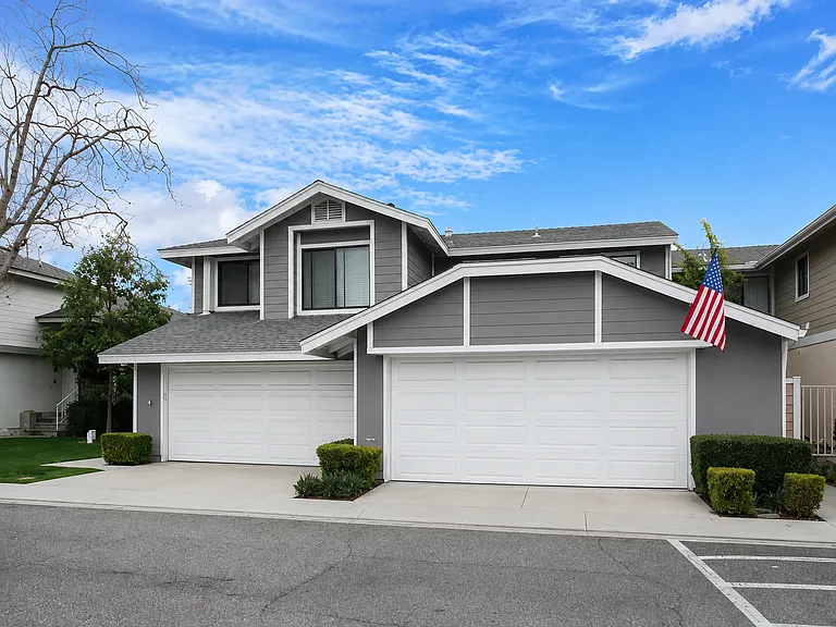 attached townhouse on left. 2 car garage with plenty of storage cabinets.