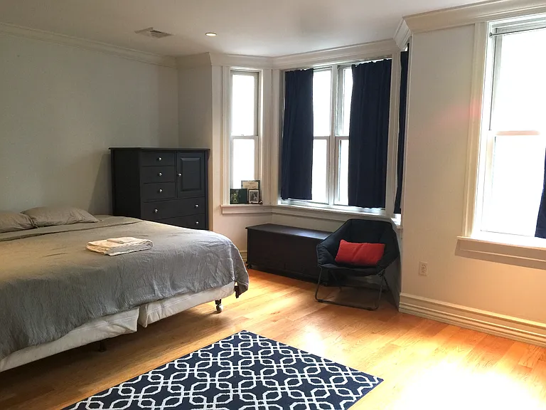 Second Floor Bedroom, north facing windows, with bed and furniture