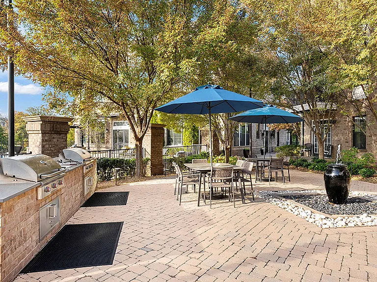 Outdoor kitchen with grilling stations