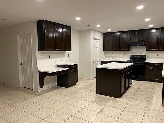 hall and kitchen doors leading to pantry/laundry room