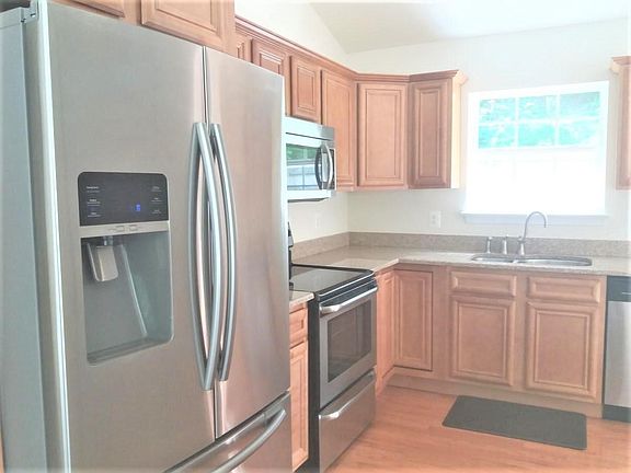 Walking into the house you will be greated at the top of the stairs directly into the kitchen. Granit countertops, upgraded SS appliances and a wonderful window over the sink to view the backyard while washing the dishes.