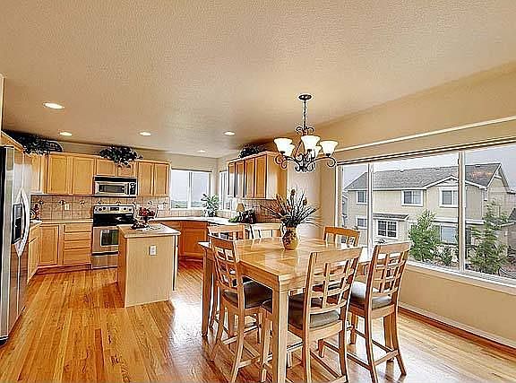 Spacious breakfast nook with lots of natural light from large picture window