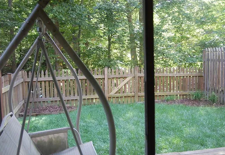Basement view. Fenced in hard. Enough space on lower deck for swing, outdoor entertaining with family / friends.
