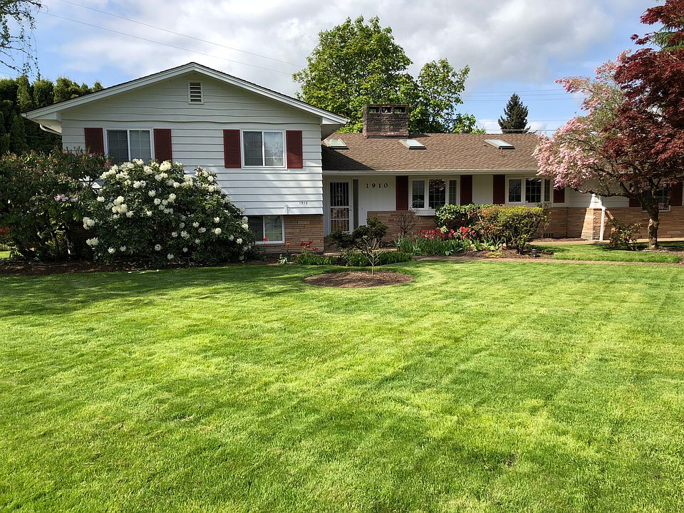 Large front lawn and entry