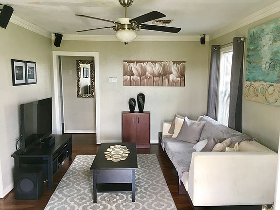 Living room. Couch and entertainment center can stay if you