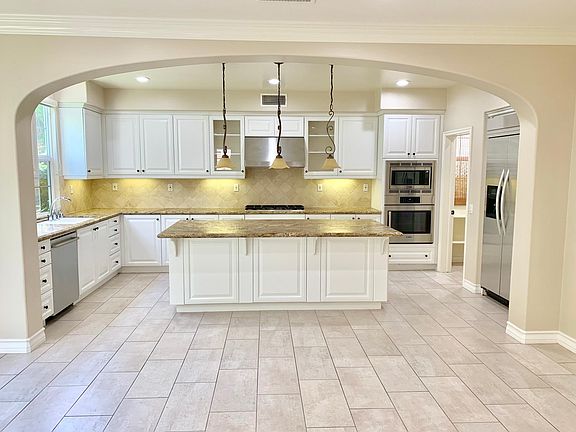 Kitchen with walk in pantry and built in appliances
