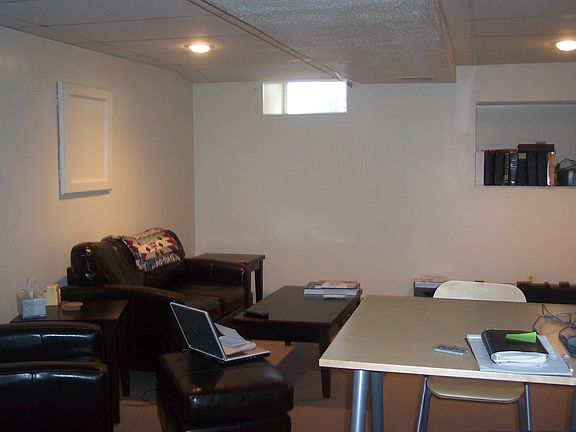 THERE'S ROOM FOR A BIG SCREEN TV IN THE FINISHED BASEMENT FAMILY ROOM!