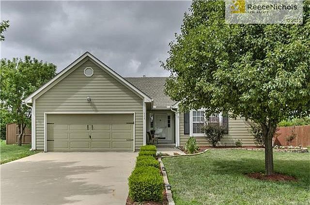 Great curb appeal - new garage doors.