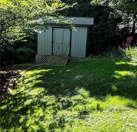 Back yard with new storage shed.