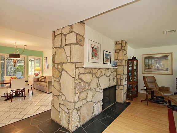 Two Sided Fireplace Open to Living Room & Kitchen