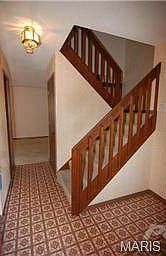 Entry foyer with two separate coat closets and half bath