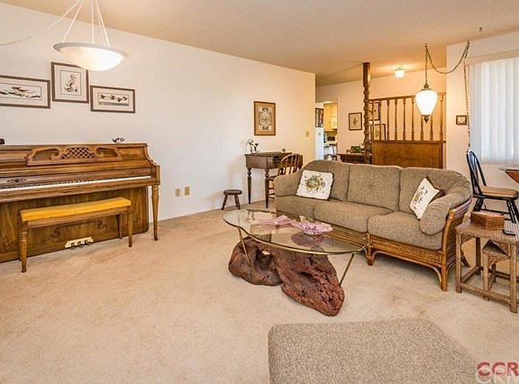 View of living room looking toward entry way and kitchen