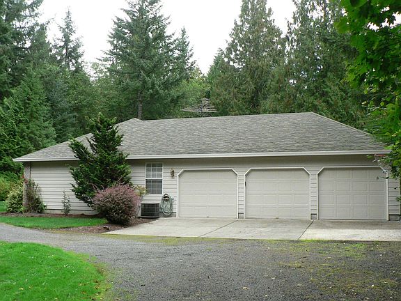 Huge 3 car garage with lots of cabinets and attic storage!