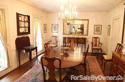 Formal Dining Room
						:
						Hardwood floor / 
Crown molding /
Forest view