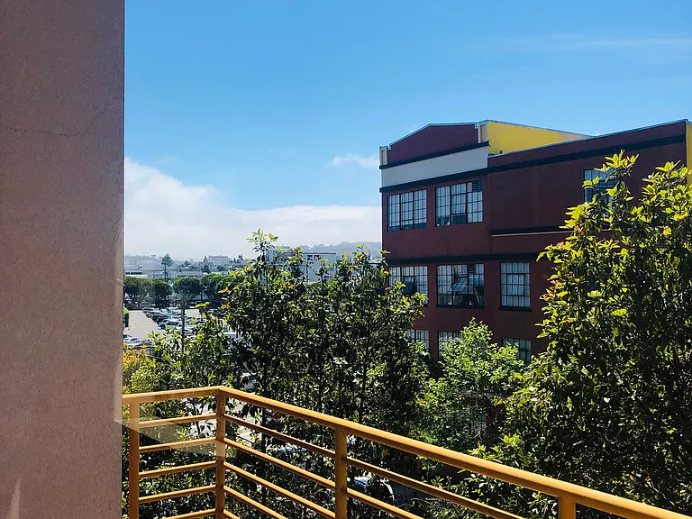 Outdoor patio located off the living room overlooks Alabama Street offering a bit of sunshine.
