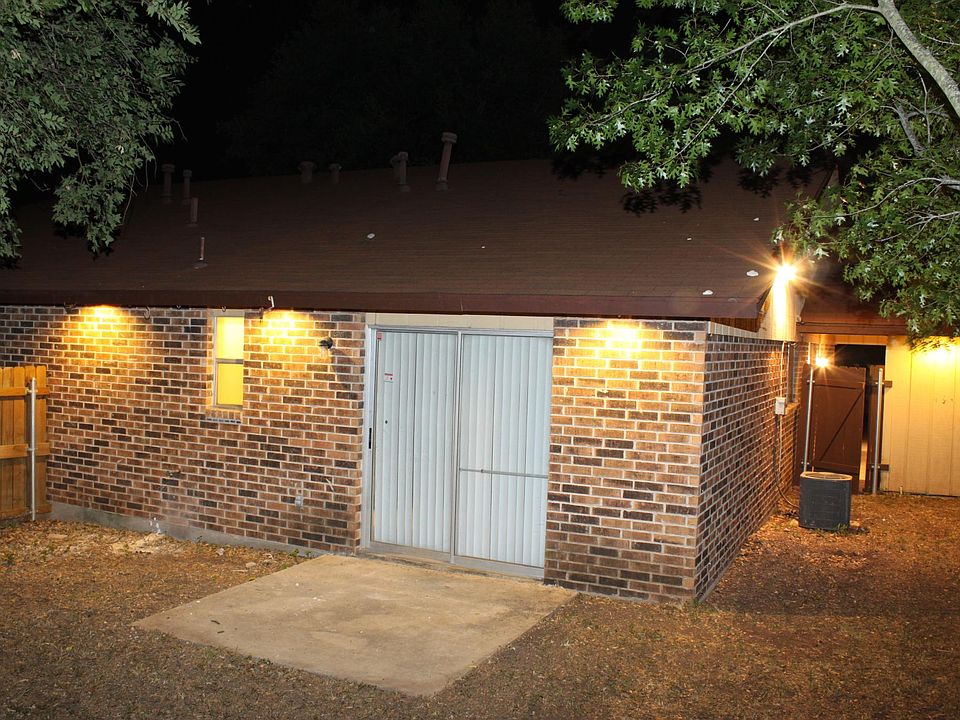Excellent night lighting in the private, fenced, backyard for both units (This photo of the adjacent 621 unit)