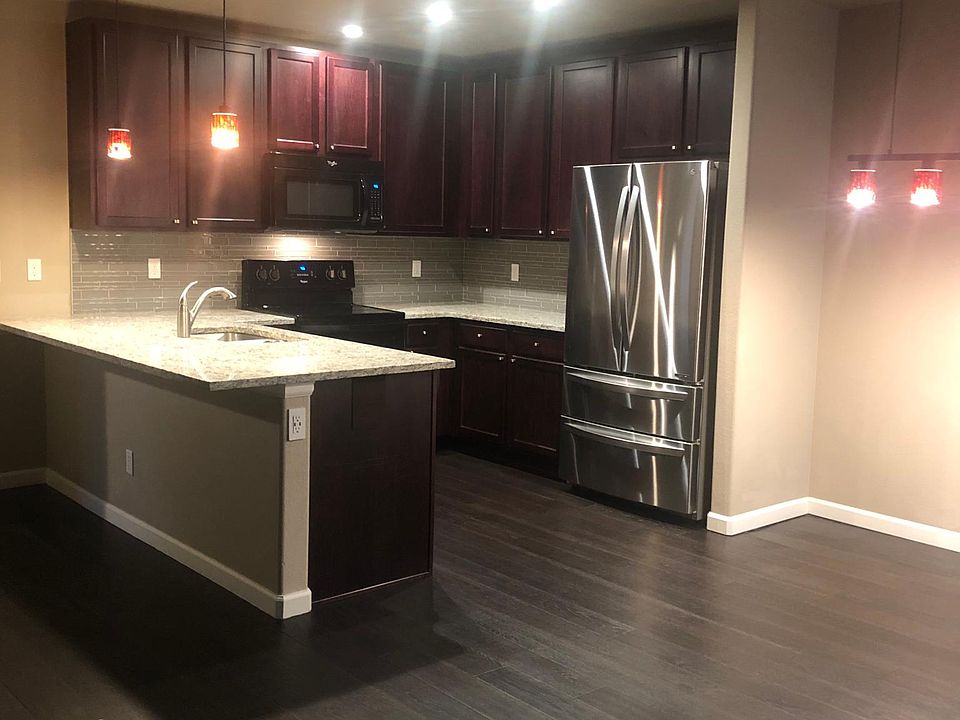 Kitchen with barstool area and room for table
