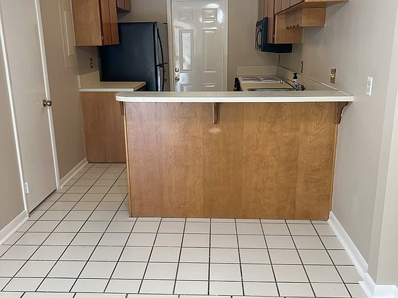 Kitchen, showing entry from one car garage