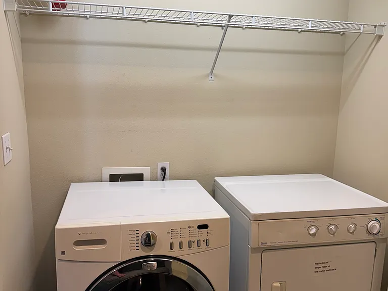 full size, front loading washer and dryer (upper level)
