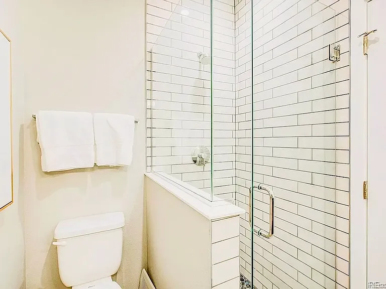 Explore this elegantly designed bathroom, featuring contemporary finishes and a glass shower. Explore this elegantly designed bathroom, featuring contemporary finishes and a glass shower.