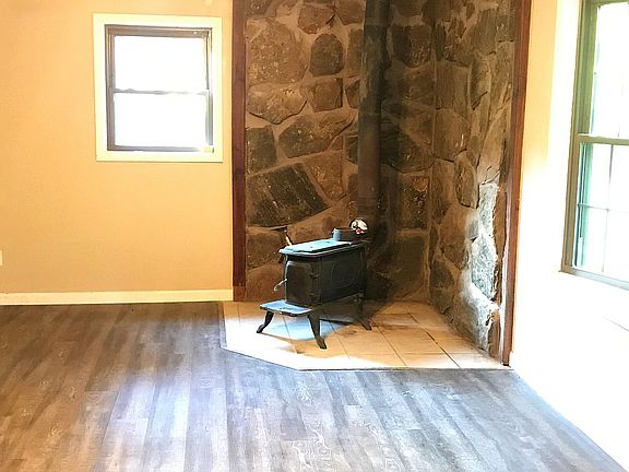Rock Wall Backed Wood Stove 