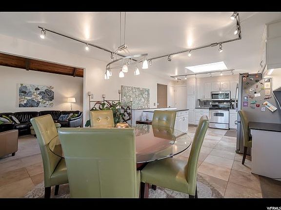DINING AREA LEADS INTO FAMILY ROOM FOR ENTERTAINING