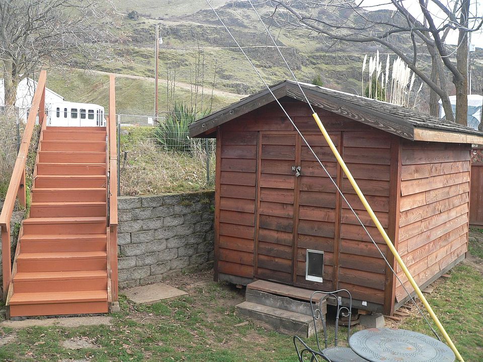 Shared Shed and small yard with stairs to road.