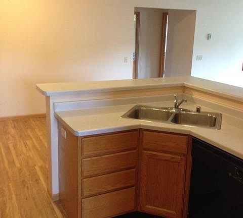 The opposite wall of the open floor plan kitchen, looking across the dining room.