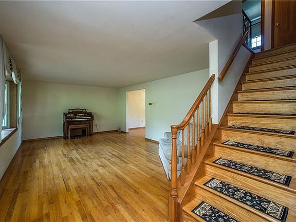 A spacious living room greets you!