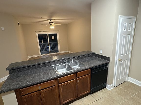 Kitchen looking towards dining room with brand new energy efficient patio doors installed.