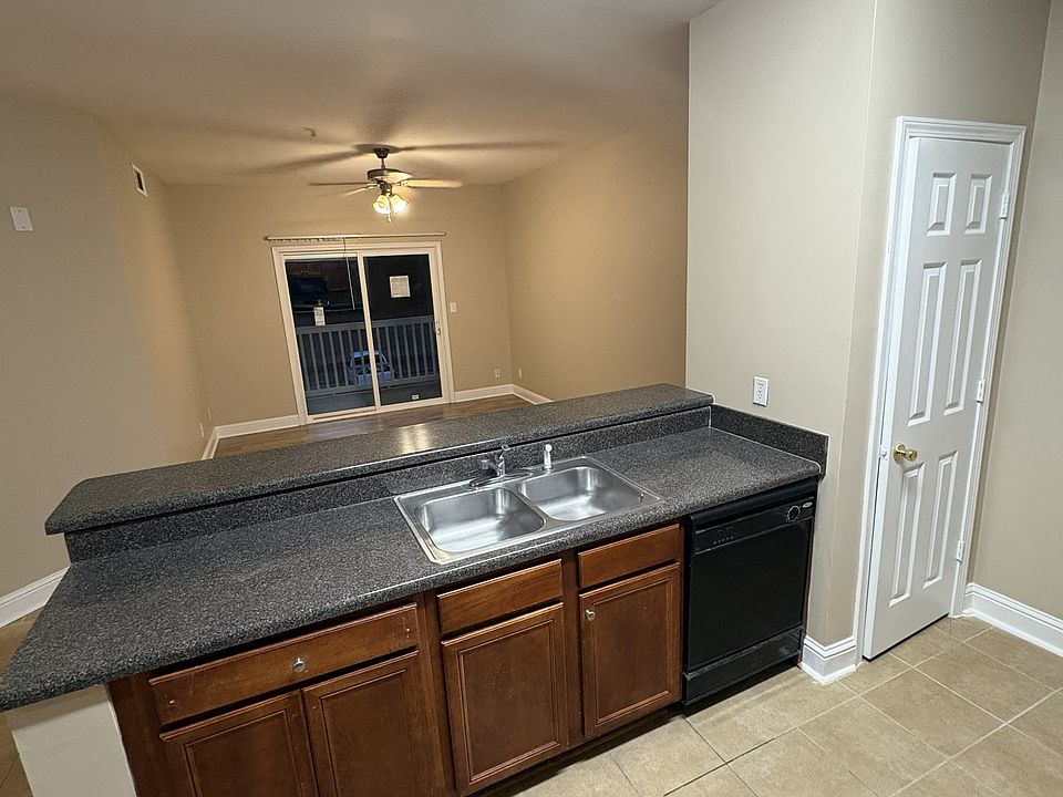 Kitchen looking towards dining room with brand new energy efficient patio doors installed.