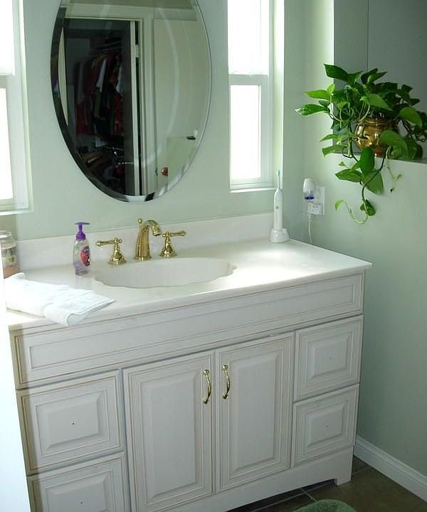 Master bath has newer vanity, faucets,mirror,flooring, commode.