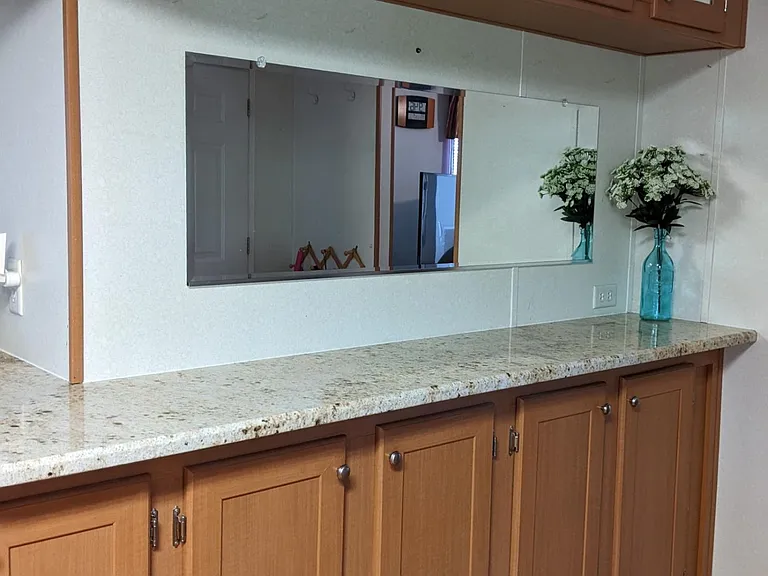 Granite countertop near entry door provides a very convenient place for keys, lunchbox etc. as you enter to home.