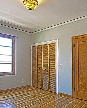 bedroom/living space with 2 closets