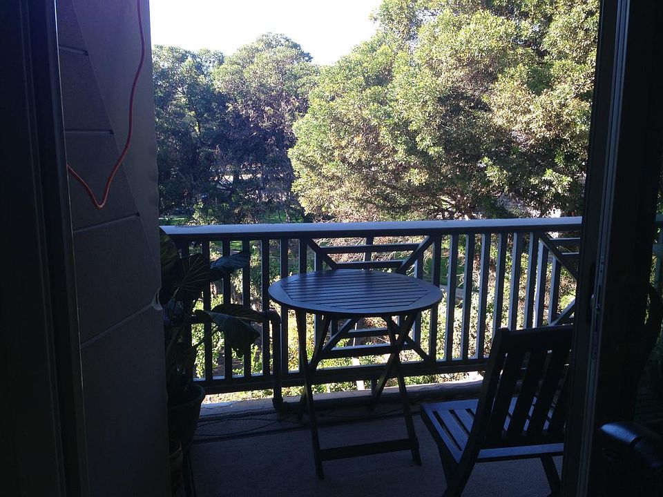 Balcony overlooking community garden and common area.