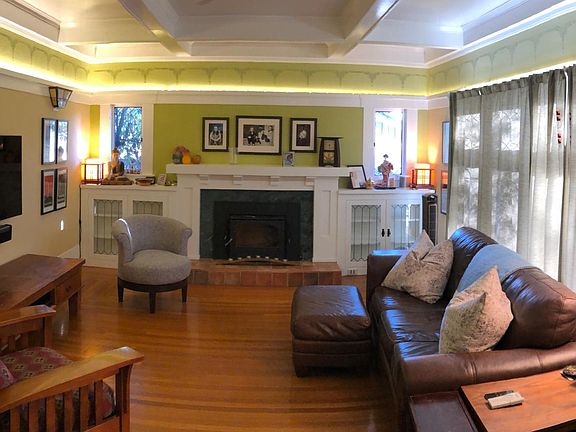 Beautiful living room with hardwood floors and stenciled freize