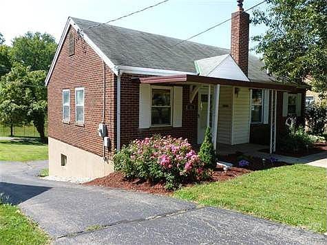Clean and Bright. Recent Updating. Rear Garage with Nice Parking Pad. Landscaped Yard.