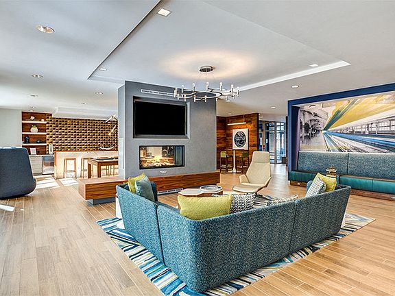 Designer clubroom with double-sided fireplace, TVs, billiards and comfortable seating