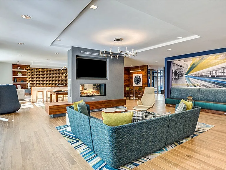 Designer clubroom with double-sided fireplace, TVs, billiards and comfortable seating
