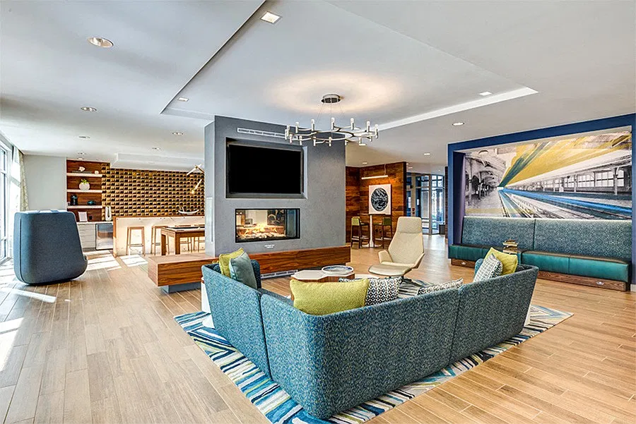 Designer clubroom with double-sided fireplace, TVs, billiards and comfortable seating