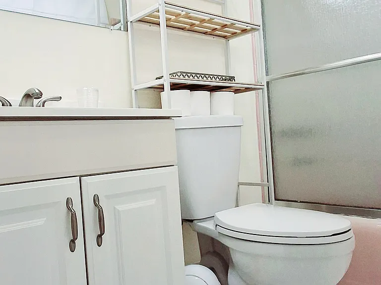 bathroom with shelving unit