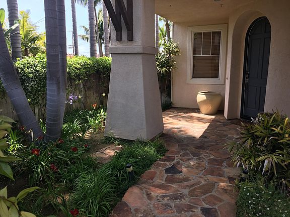 Front walkway - flagstone, arched door.