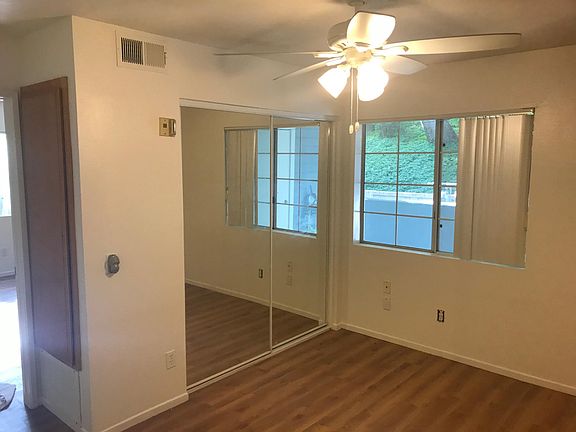 Bedroom- remote control ceiling fan, sliding mirror door closet, HVAC cabinet