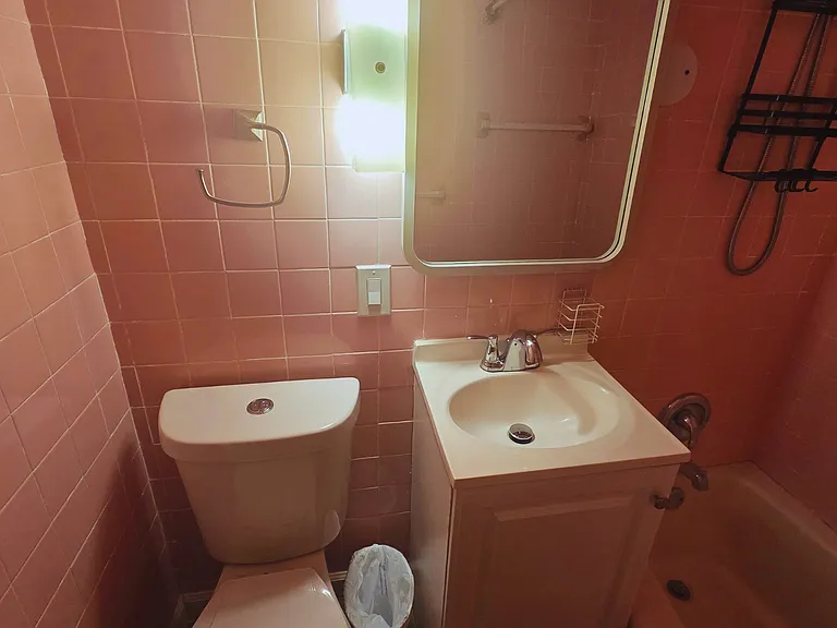 Vanity with cabinet storage for toiletries and personal essentials.
