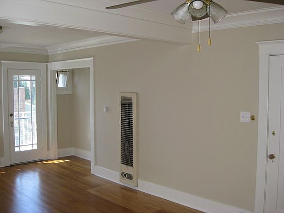 doors opens to a balcony with a view of Long Beach