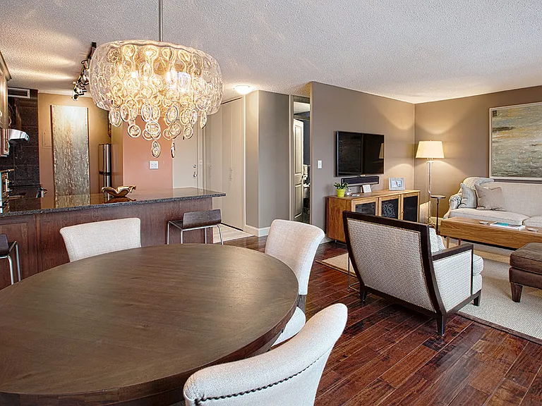 Kitchen with cherry cabinets, hardwood floors, stainless steel appliances, granite countertops