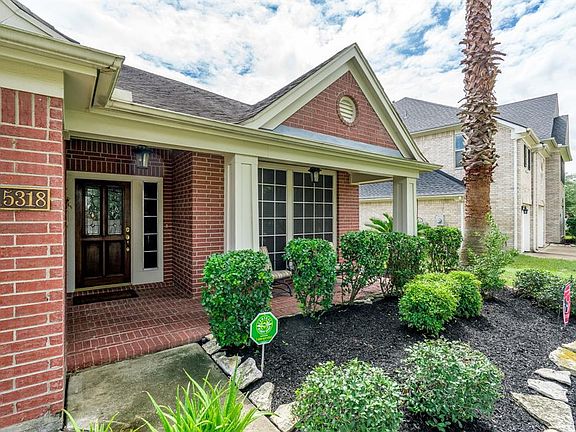 Mature trees with fresh landscaping provides a serene backdrop to the welcoming front porch, and offers great curb appeal!