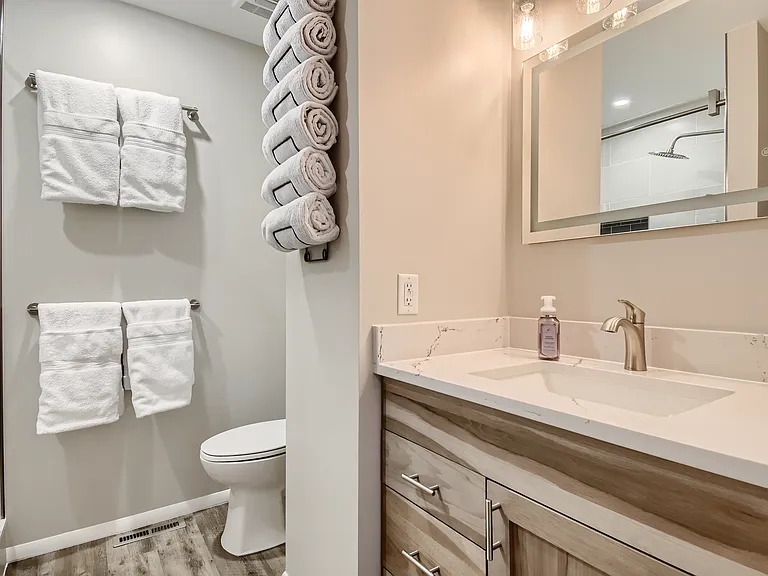master bathroom en suite with heated mirror and walk in shower