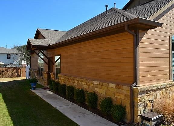 Door is on the side of the unit. Landscaping maintained by the HOA. Peaceful and quiet with lots of privacy.